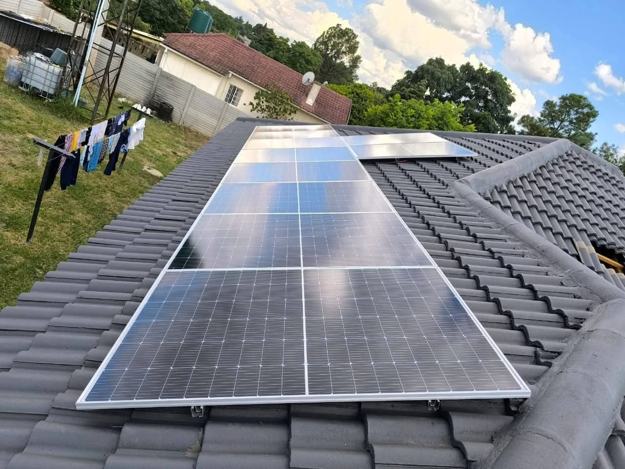 10 × 585W solar panels mounted on residential rooftop, Waterfalls Harare